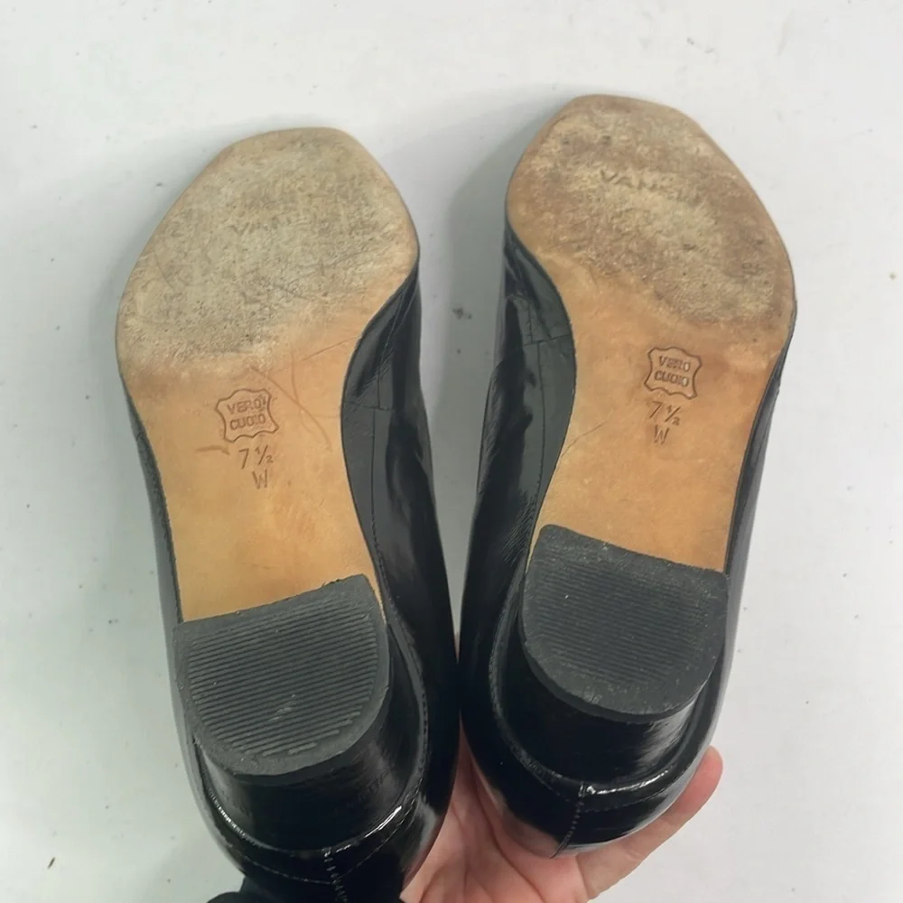 Vaneli black eel skin? Pumps w rounded square toe. Suede and gold buckle detail.